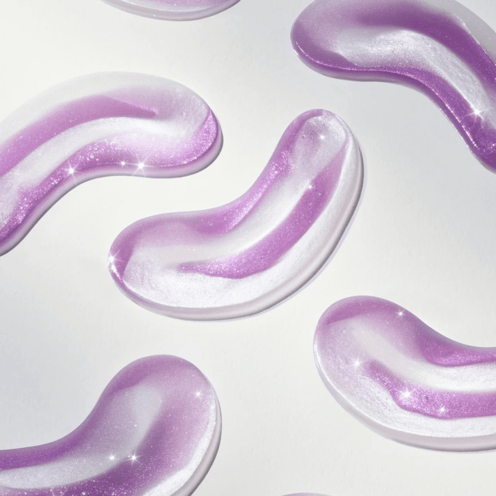 Patchs pour les yeux en hydrogel de teinte violette de 360° Shot PDRN Glowing Eye Patch, conçus pour apporter éclat, hydratation et une peau plus lisse sous les yeux.