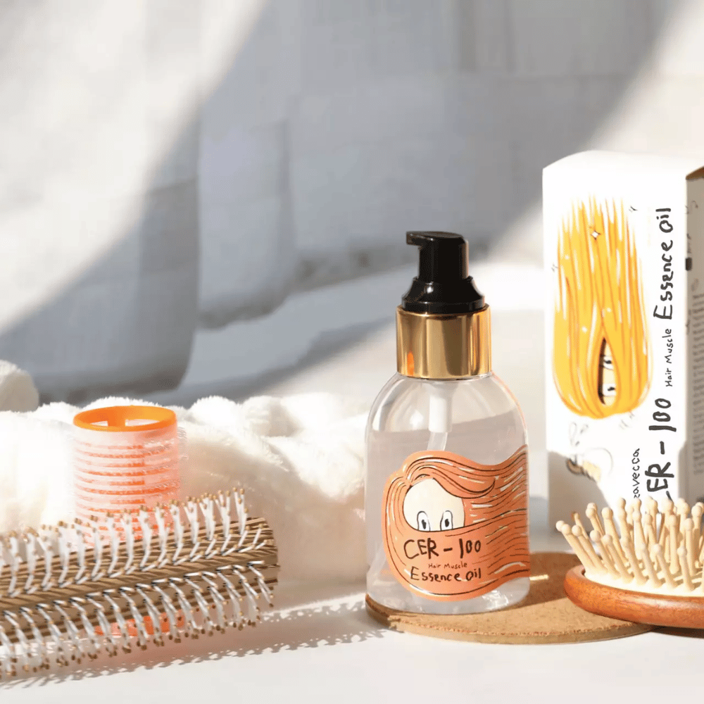Elizavecca CER-100 Hair Muscle Essence Oil coiffage – huile capillaire hydratante qui aide à réduire les frisottis, donner de la brillance et protéger les cheveux lors du coiffage.