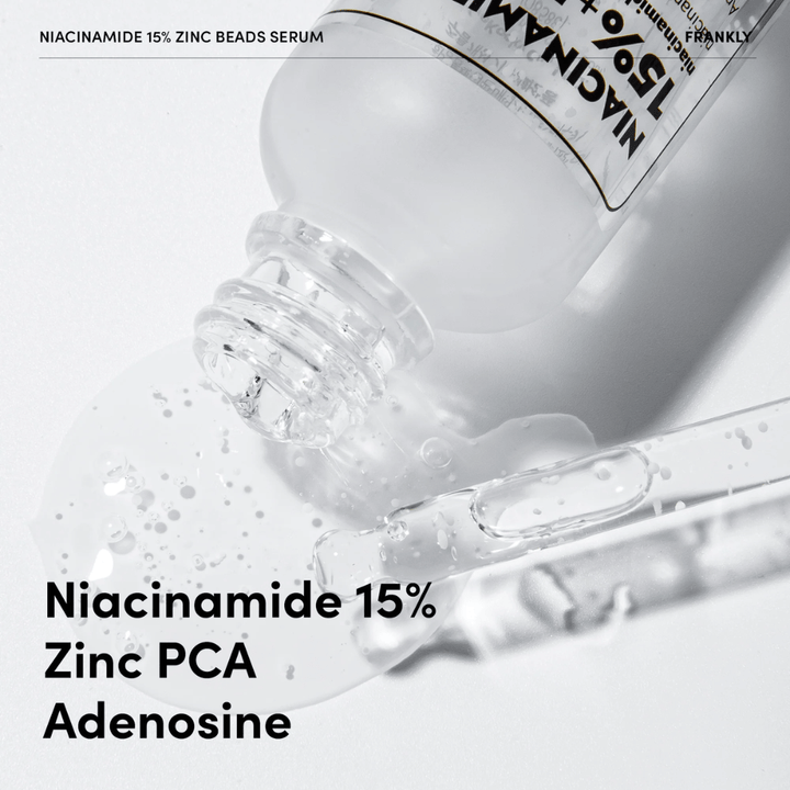 Närbild av FRANKLY Niacinamide 15% + Zinc Beads Serum som hälls ut. Text visar ingredienser: Niacinamide 15 %, Zinc PCA och Adenosine.