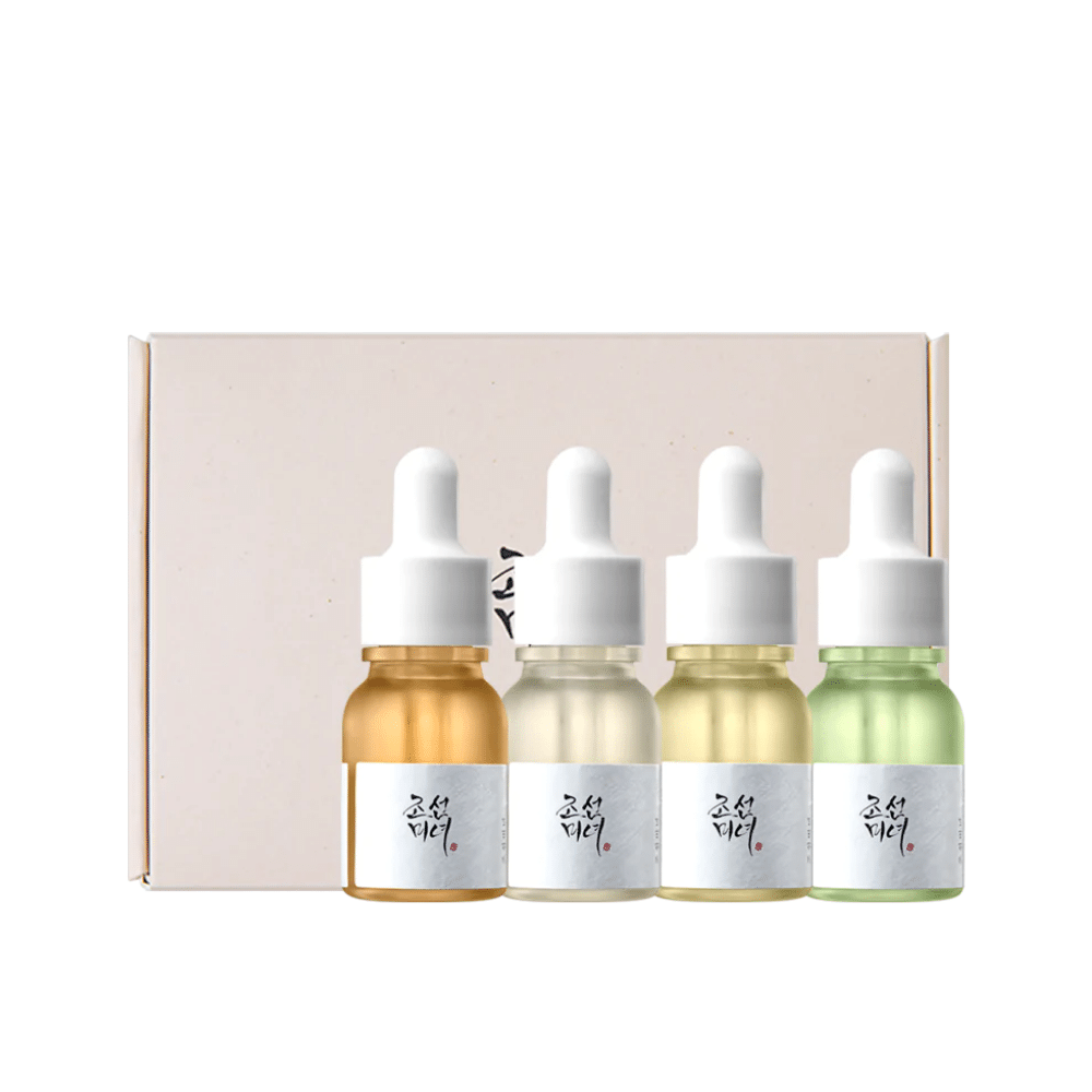 Une boîte avec trois bouteilles Hanbang Serum Discovery Kit 4 pcs de Beauty of Joseon, chacune favorisant un éclat de jeunesse et réduisant les rides.